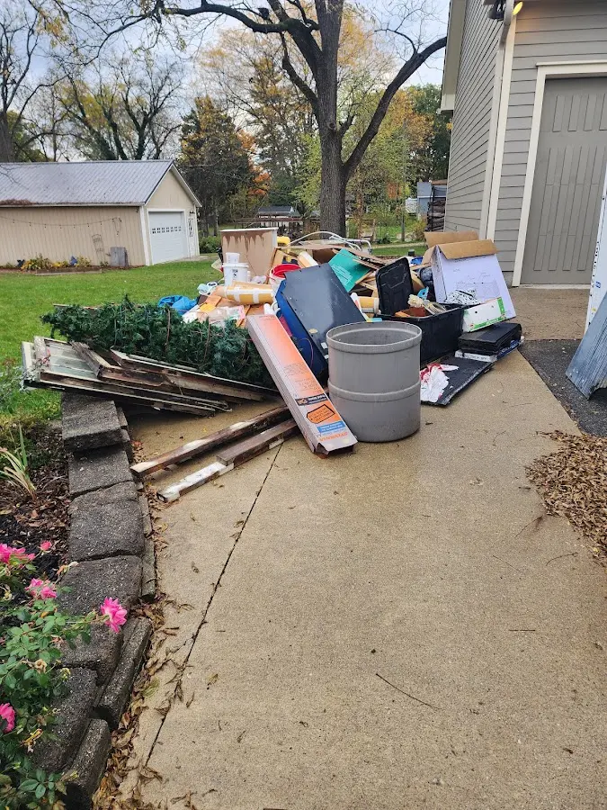 Dumpster being loaded with debris for 30 Yard Dumpster Rental in West Hattiesburg